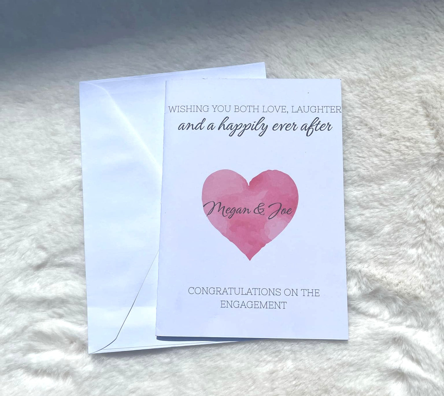 Personalised wedding engagement card with pink heart design and white envelope