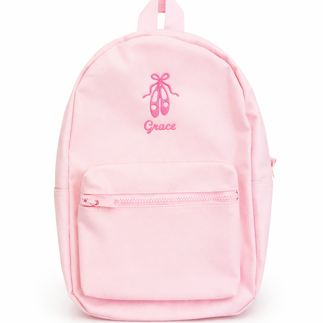 Pink backpack with 'Grace' and ballet shoes design on a white background