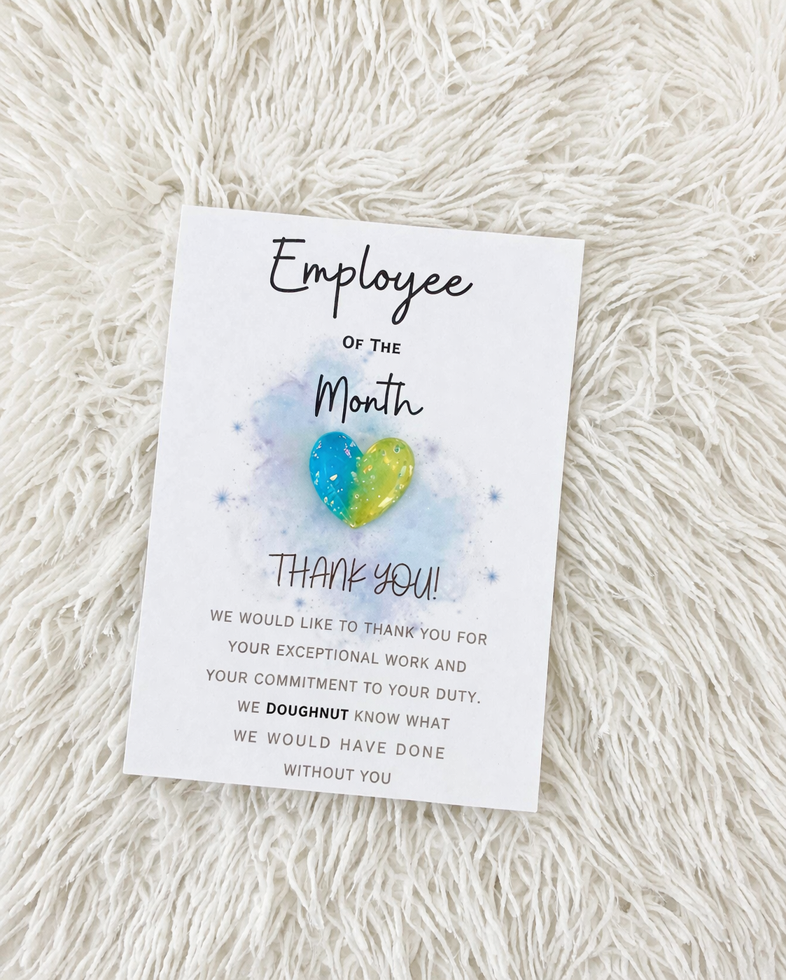 Card with 'Employee of the Month' text and colorful doughnut graphic on a textured white background