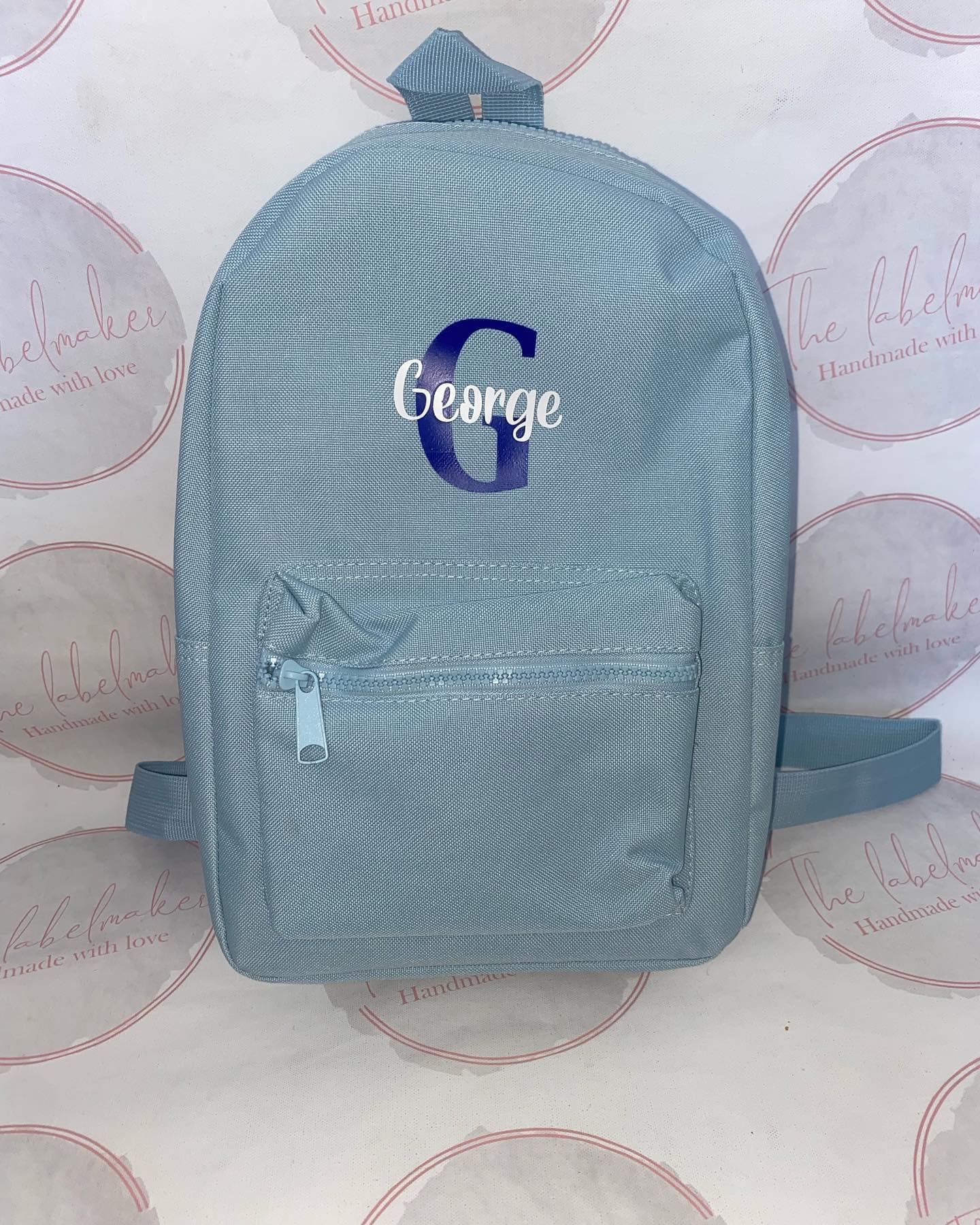 Light Blue 7 litre Back with white and blue name and initials text