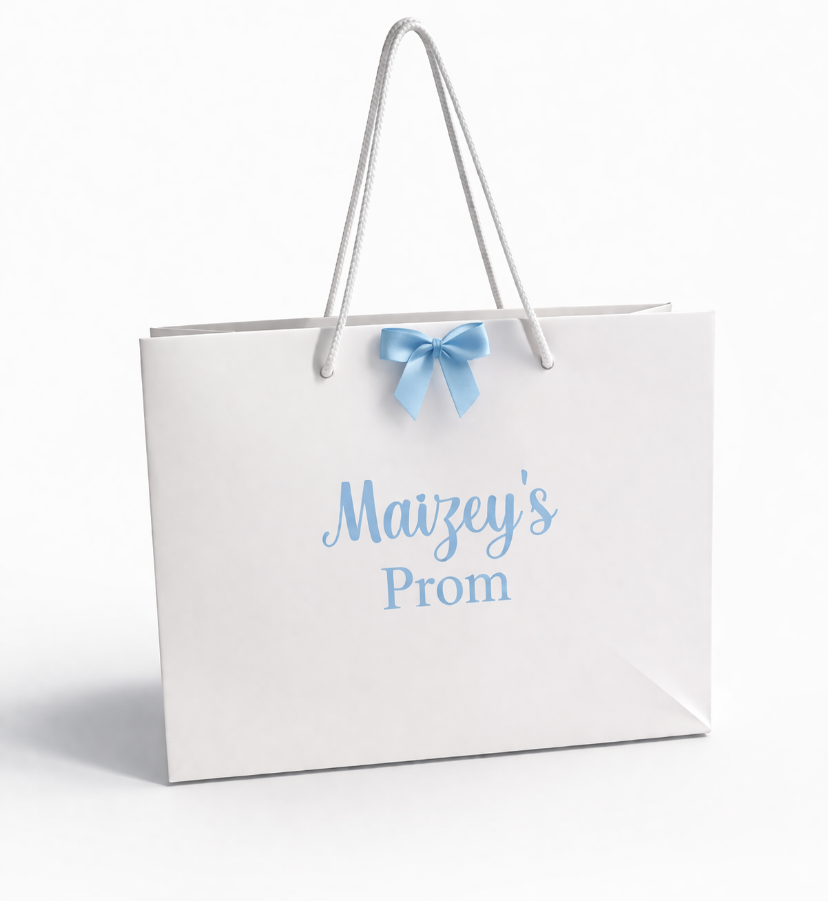 White gift bag with 'Maizey's Prom' text and a blue bow on a white background