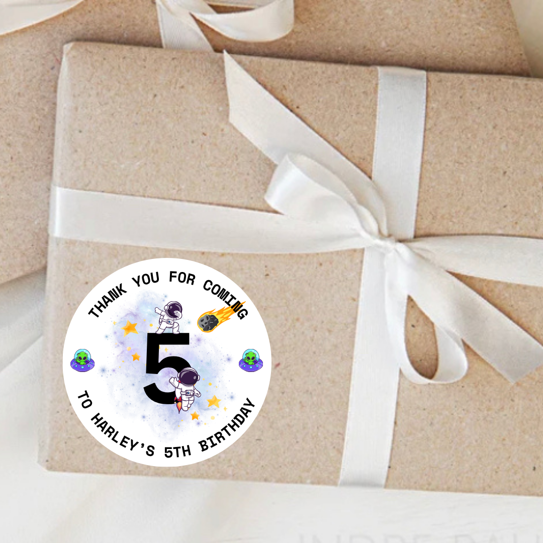 Gift wrapped in brown paper with a white ribbon and a personalised Space themed sticker on a white background