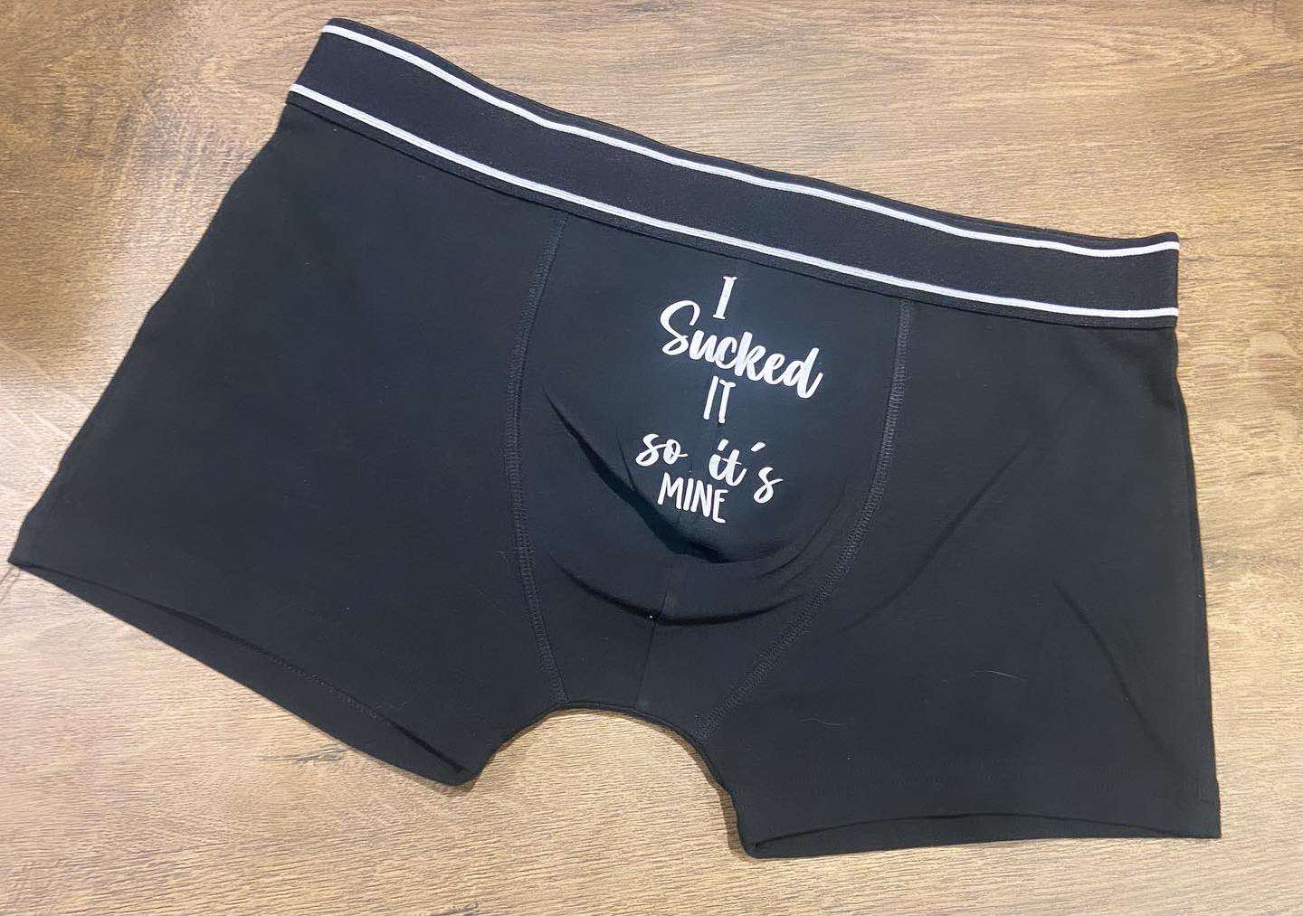 Black boxers with the words i sucked it so its mine in white for valentines day