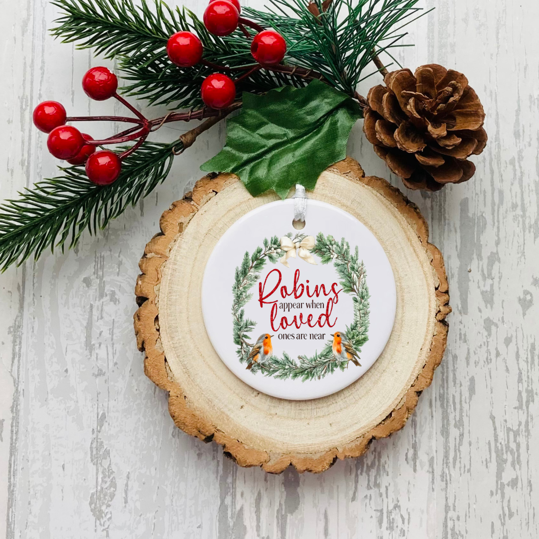 Personalised ceramic Christmas bauble with Believe in Magic festive wreath