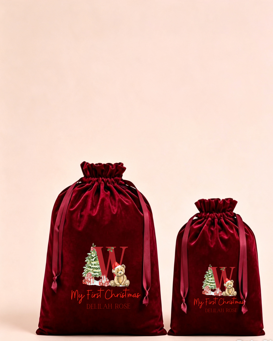Personalised red velvet Christmas sack in medium and large with first Christmas initial design
