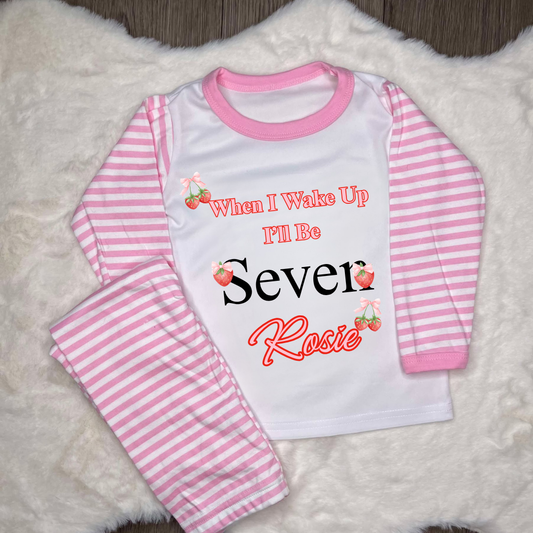 Pink striped pyjamas text when I wake up I’ll be seven with strawberry images 