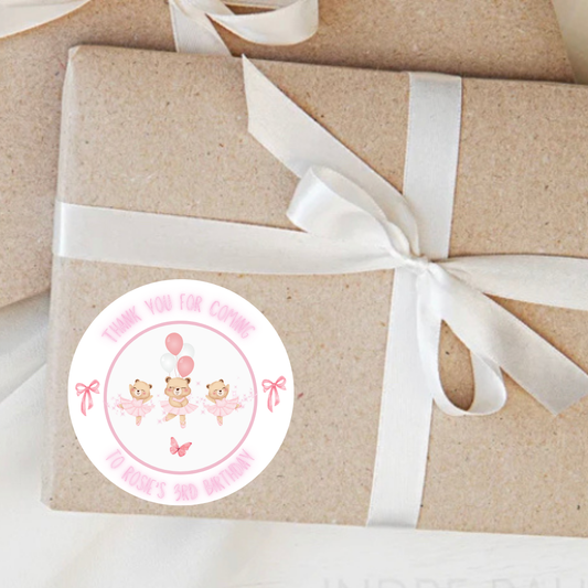 Gift box wrapped in brown paper with a white ribbon and a pink Personalised Ballerina sticker.