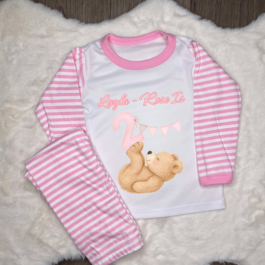 Pink striped pyjamas with little bear with a pink number 2 and bunting with personalised text 