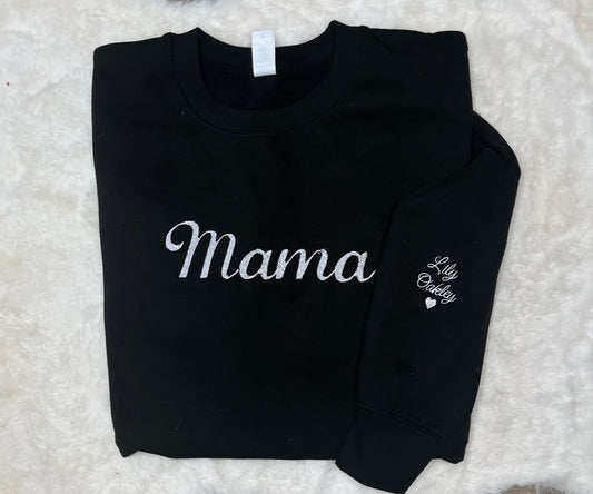 Black sweatshirt with 'Mama' and 'Lily Oakley' text on a textured white background