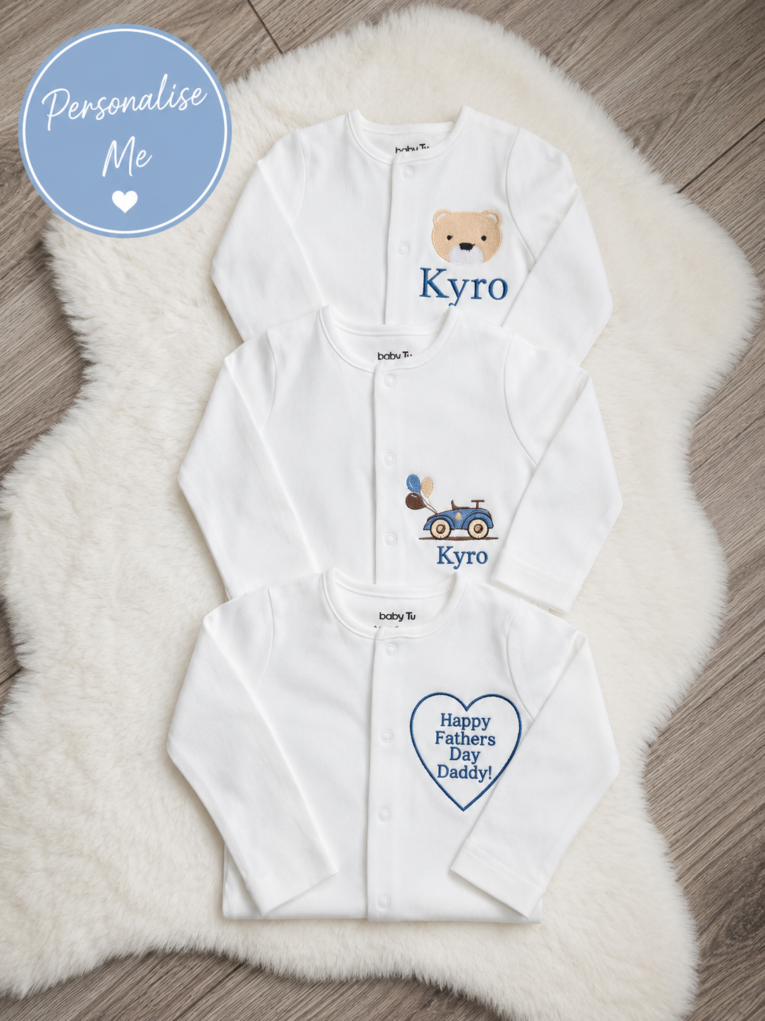 Embroidered newborn sleepsuit customised with baby name and design