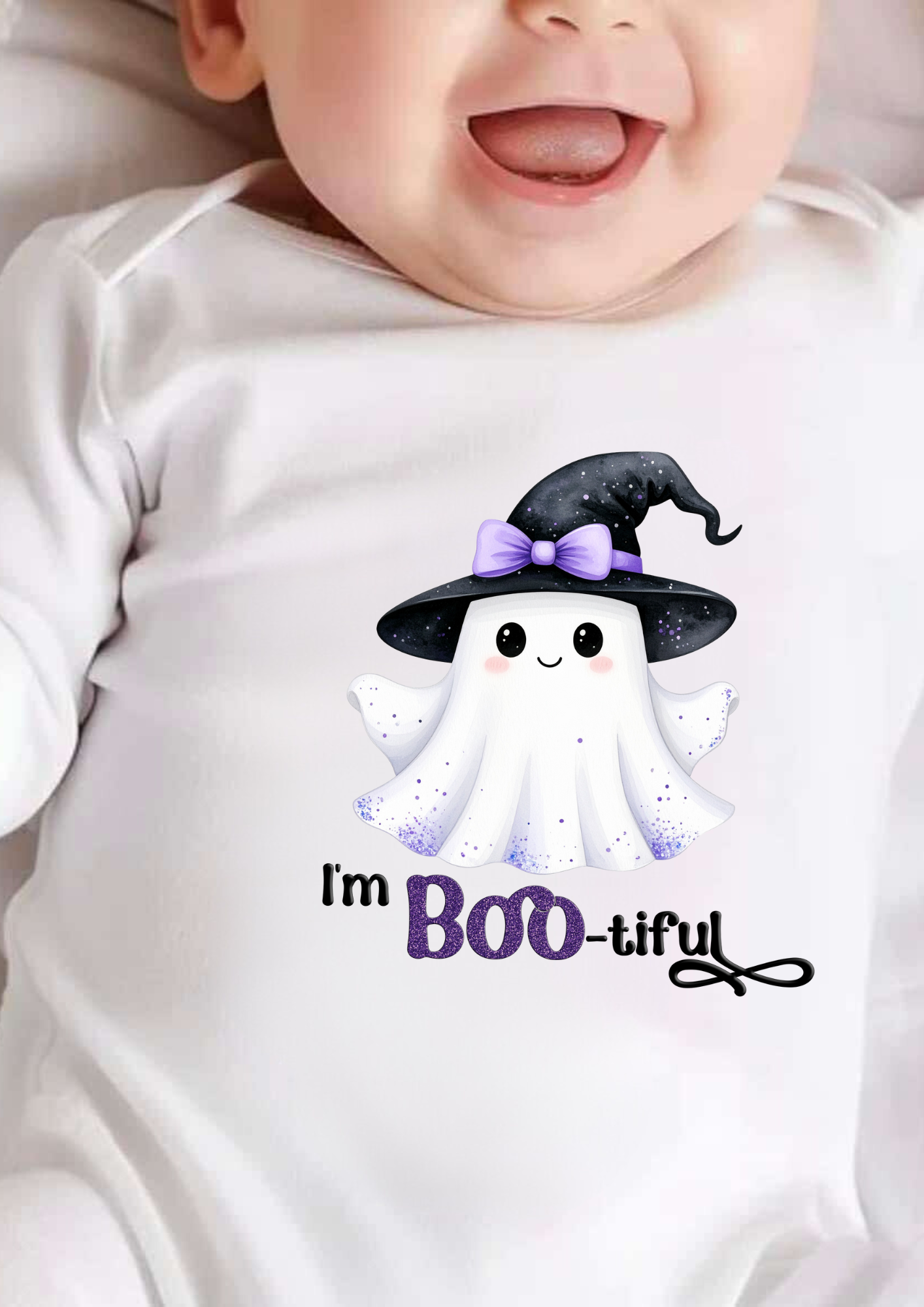 Baby wearing a Halloween-themed onesie with a ghost and text.