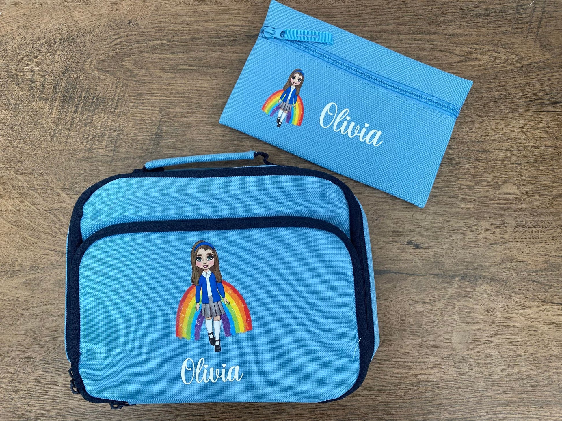 Light blue personalised pencil case with image of a person with a rainbow