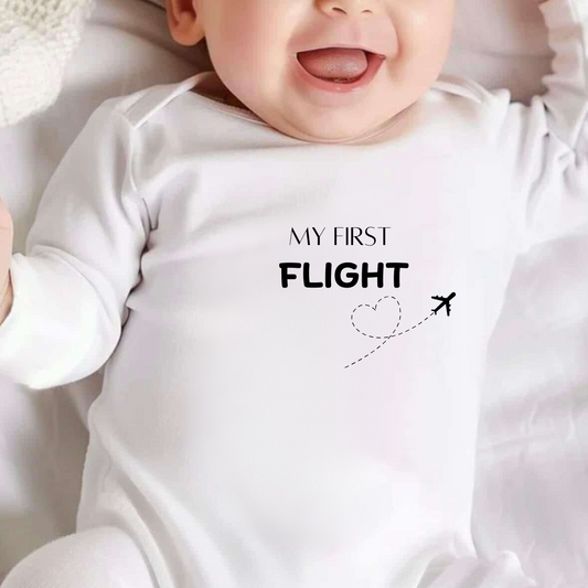 White baby vest with text 'My First Flight\' 