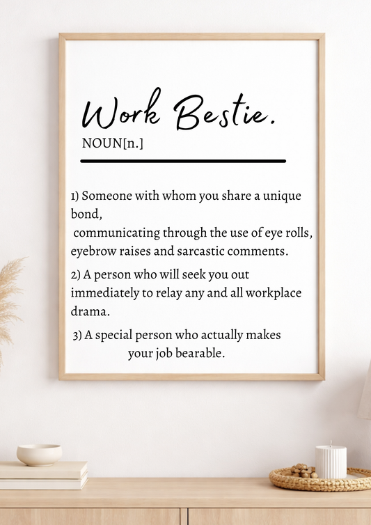 Framed print with definition of 'Work Bestie' on a wall.