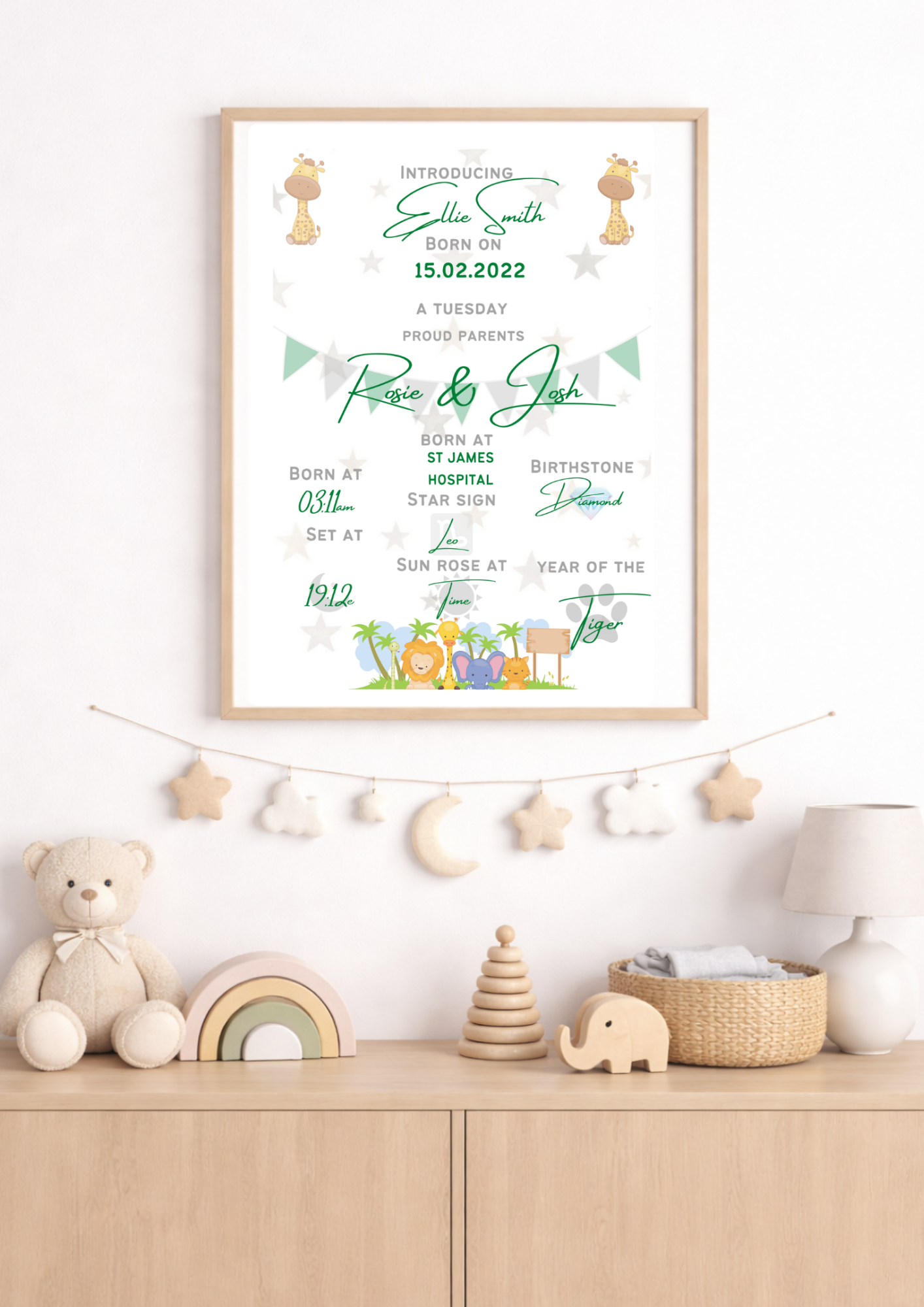 Nursery room with a framed birth announcement poster on the wall.