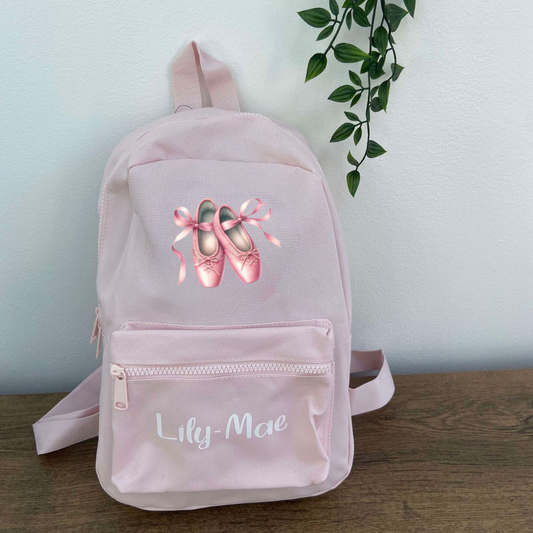 Pink back pack featuring ballet shoes and child's name
