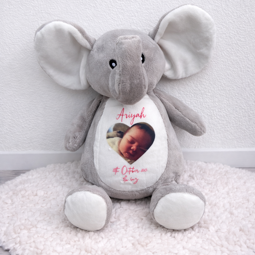 Gray elephant plush toy with a personalized photo and text on a white background