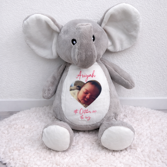 Gray elephant plush toy with a personalized photo and text on a white background