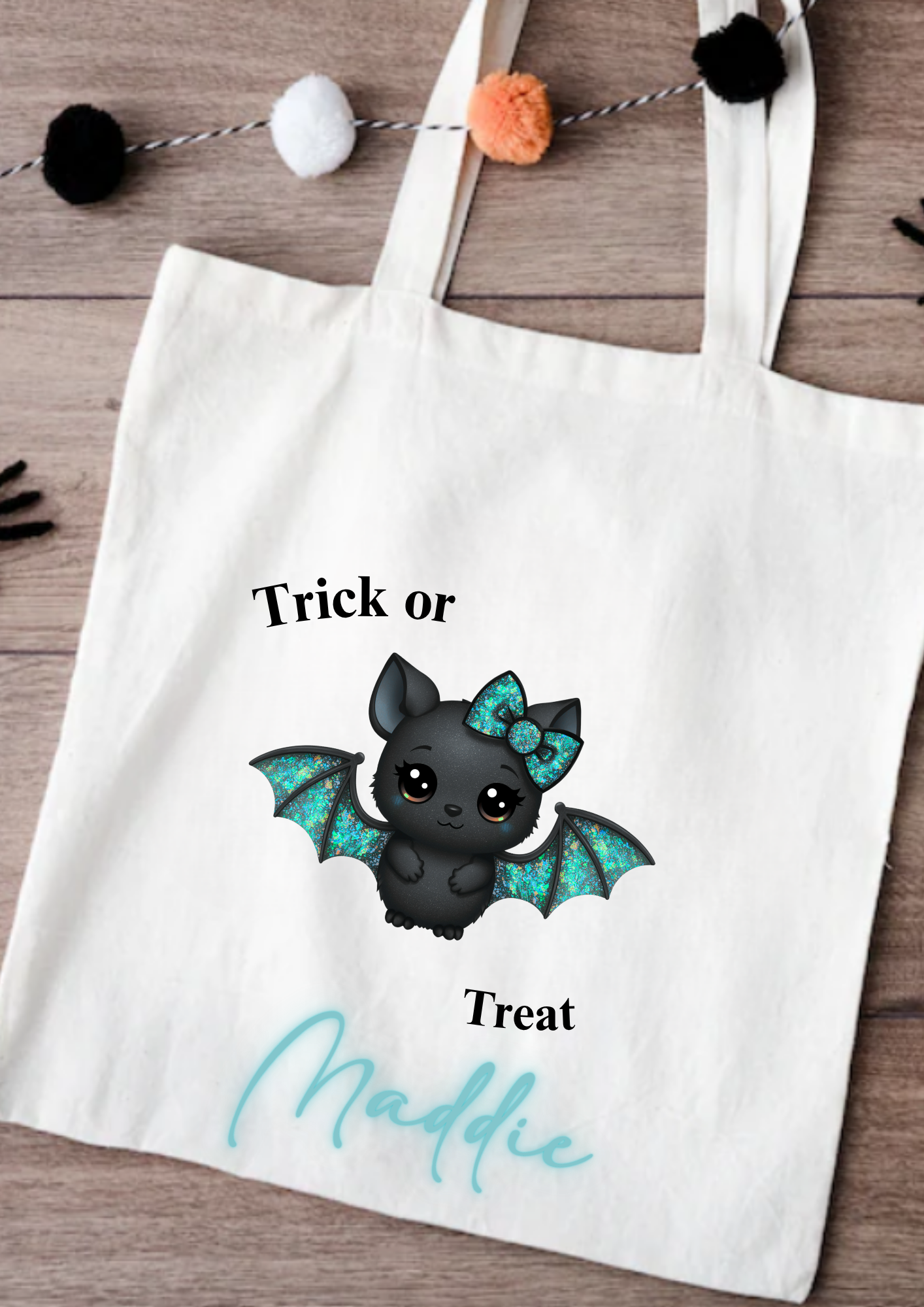 Tote bag with a bat design and text on a wooden surface