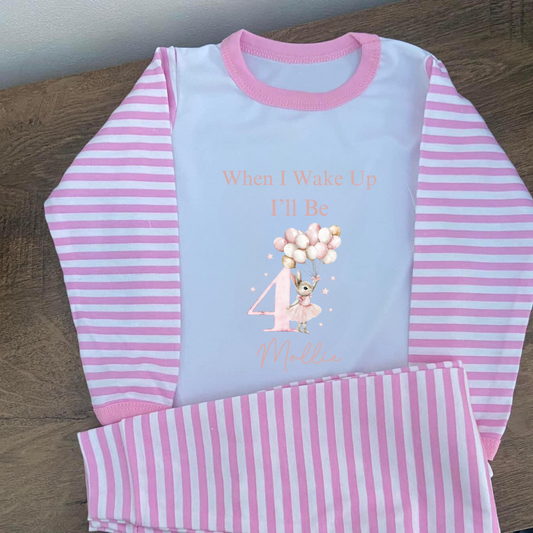 Pink stripey pyjamas with the words when I wake up I'll be 4 with n image of a little bunny wearing a ballet dress with balloons
