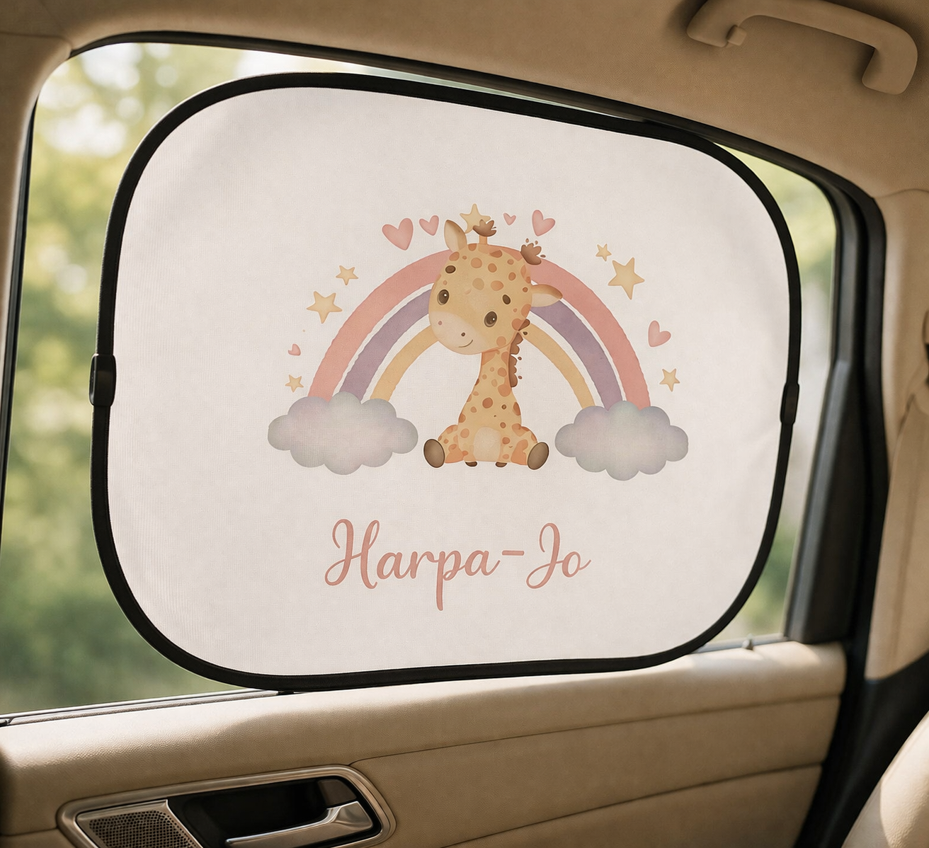 Car sunshade with a giraffe and rainbow design inside a car