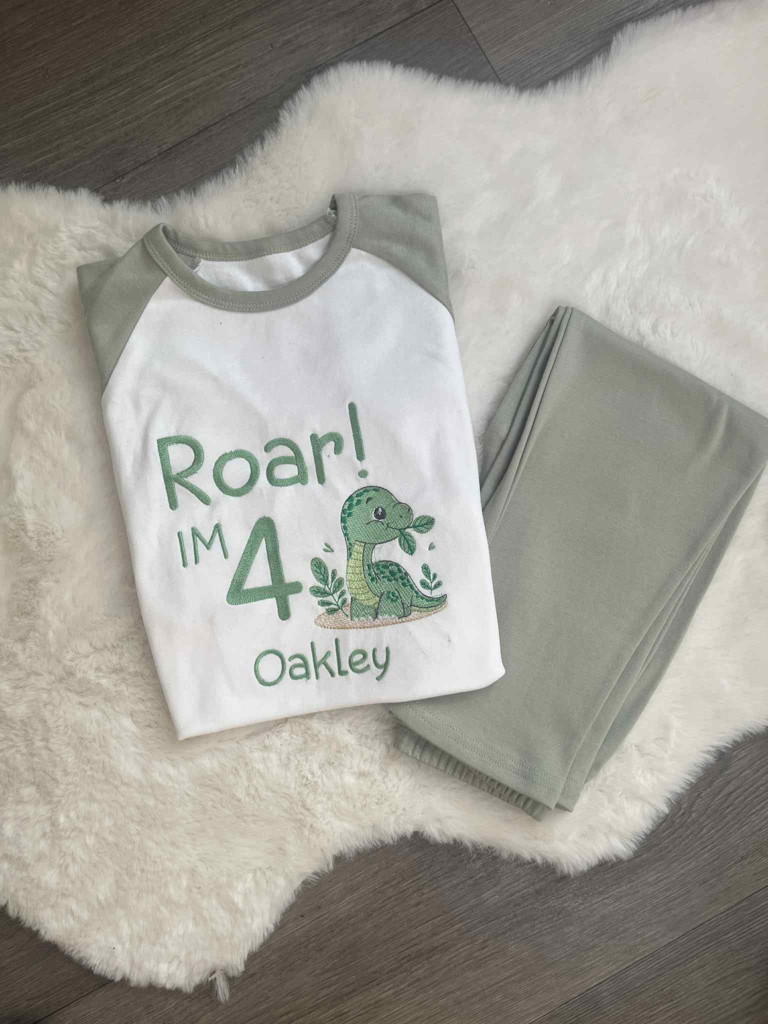 Children's Embroidered Pyjamas With Dinosaurs on them