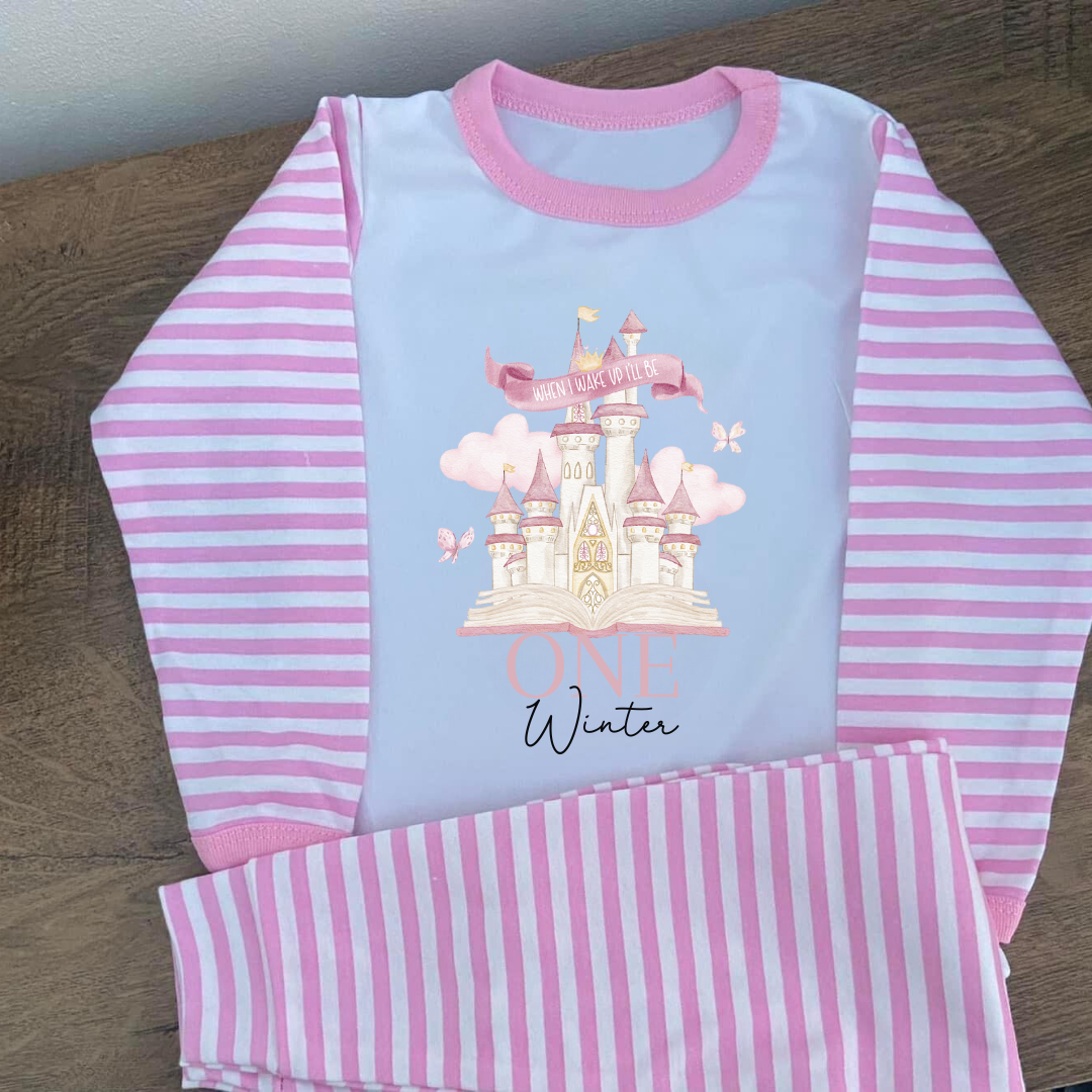 Pink striped pyjamas with the word when i wake up ill be one on them with an image of a princess castle and castles