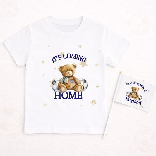 White t-shirt with teddy bear graphic and text 'It's Coming Home' on a white background