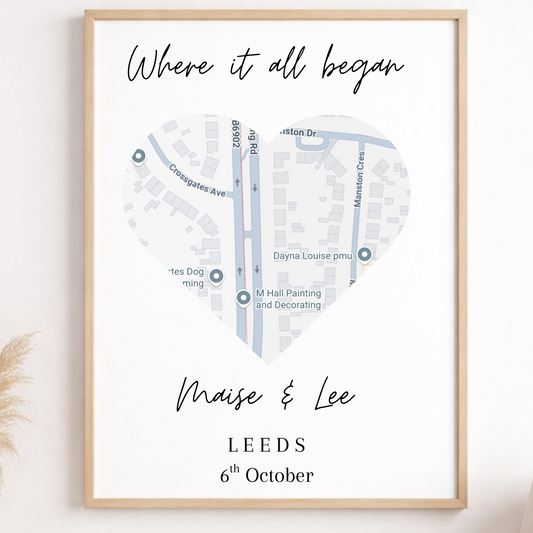 Framed map print with personalized text on a wall