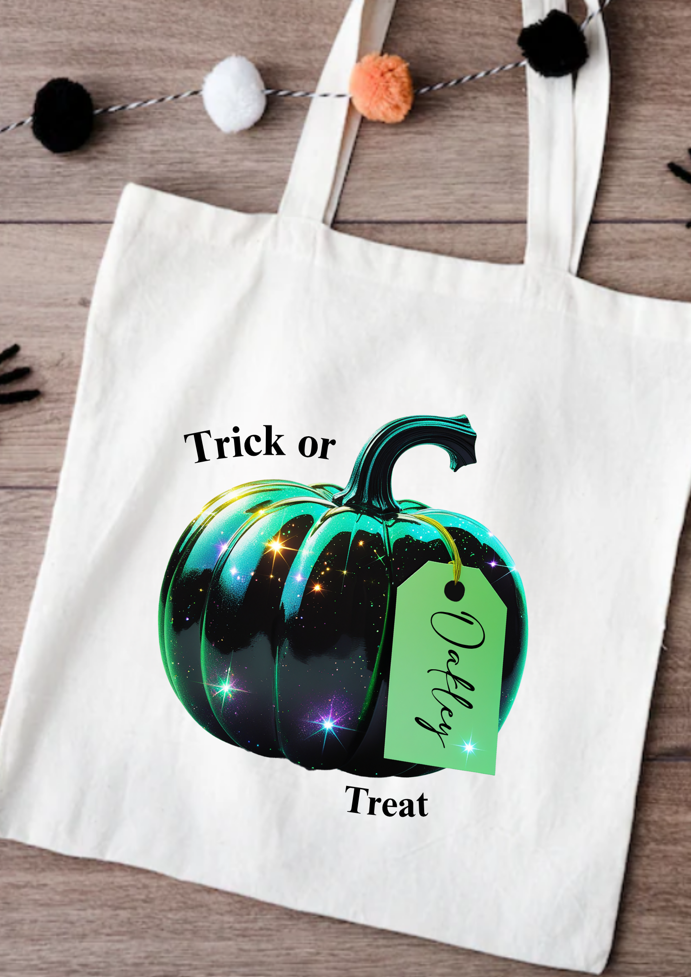 Tote bag with a Halloween-themed pumpkin design and text on a wooden surface.