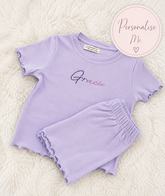 Purple children's outfit with 'Gracie' on a white background
