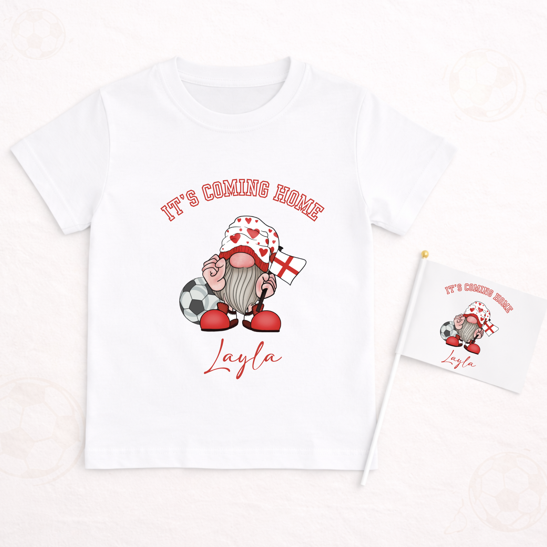 White t-shirt with a gnome graphic and text 'It's Coming Home Layla' on a white background