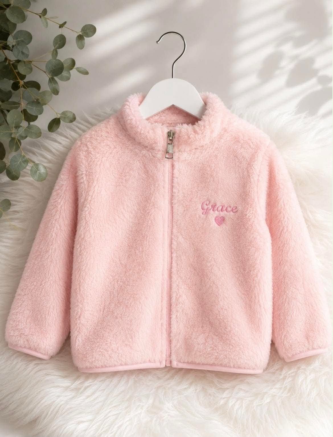 Personalised children’s teddy fleece jackets available in sage green, brown, light blue, grey, pink, mustard and white.