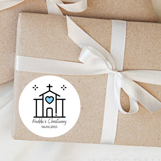 Gift wrapped in brown paper with a white ribbon and personalized sticker on a light background