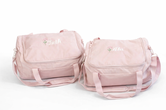 Personalised pink holdall travel bag with name embroidery and adjustable shoulder strap