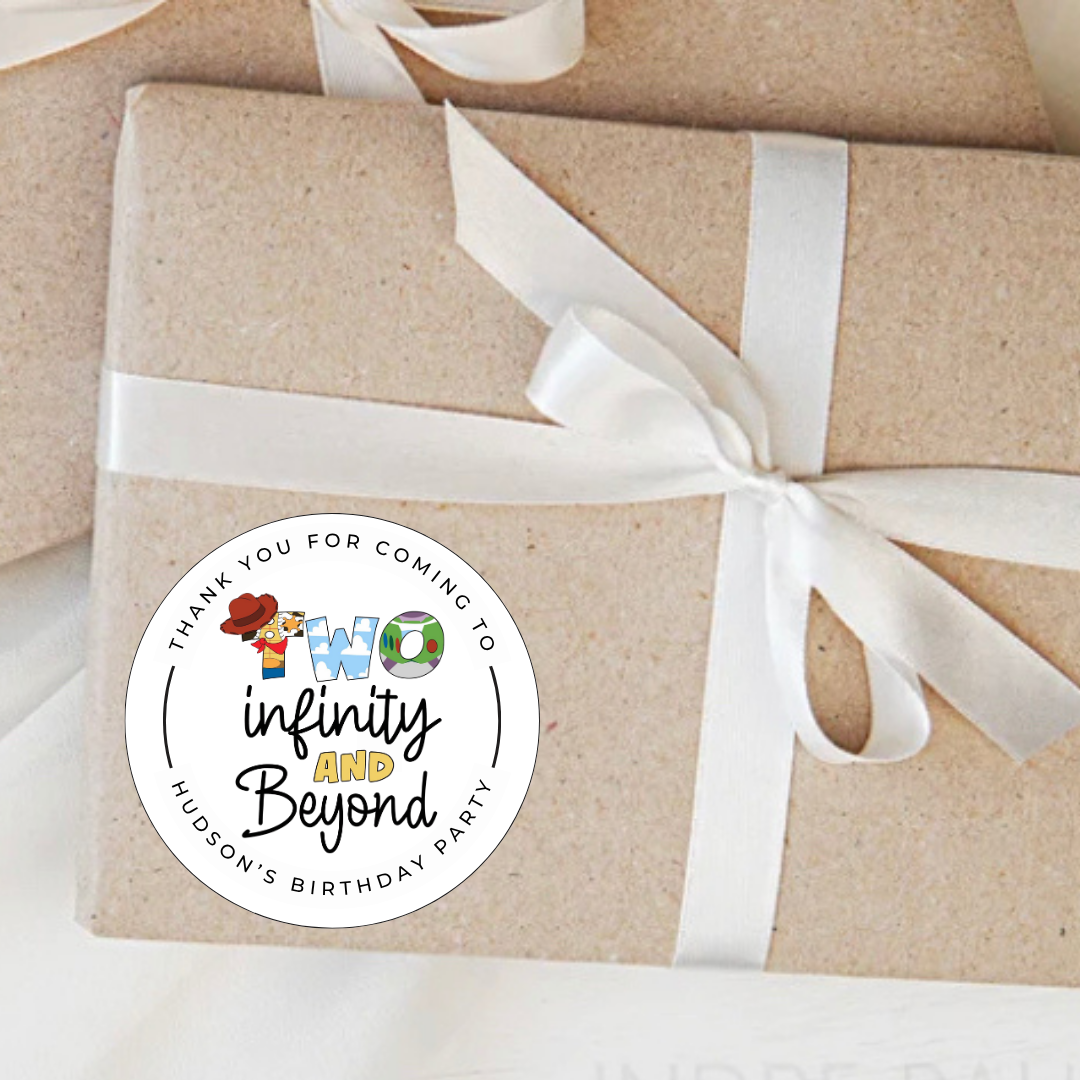 Gift wrapped in brown paper with a white ribbon and a personalized sticker on a white background