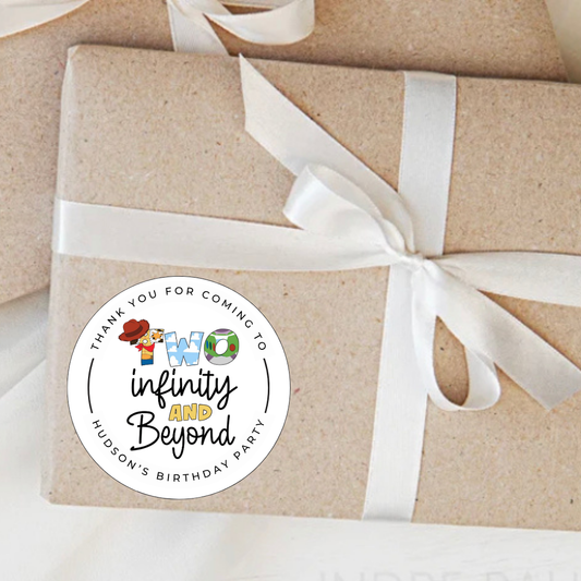 Gift wrapped in brown paper with a white ribbon and a personalized sticker on a white background