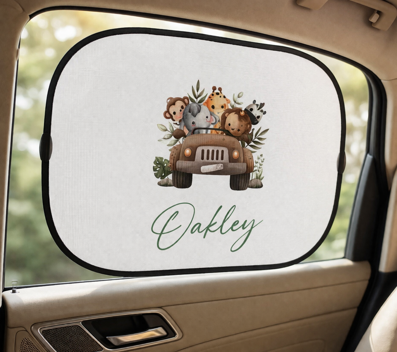 Car sunshade with cartoon animals and 'Oakley' text inside a vehicle.
