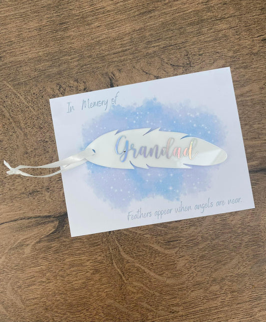 White acrylic Memorial Feather gift with text saying grandad in silver on card backing.