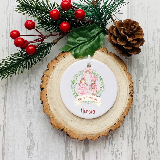 Personalised ceramic Christmas bauble with pink Christmas castle wreath, name and optional year