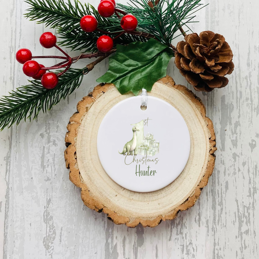 Personalised ceramic Christmas bauble with green festive First Christmas design