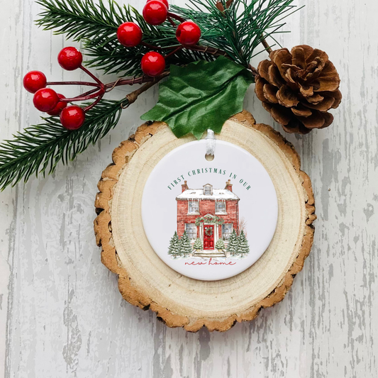 Personalised ceramic Christmas bauble with red house and first Christmas in a new home wording