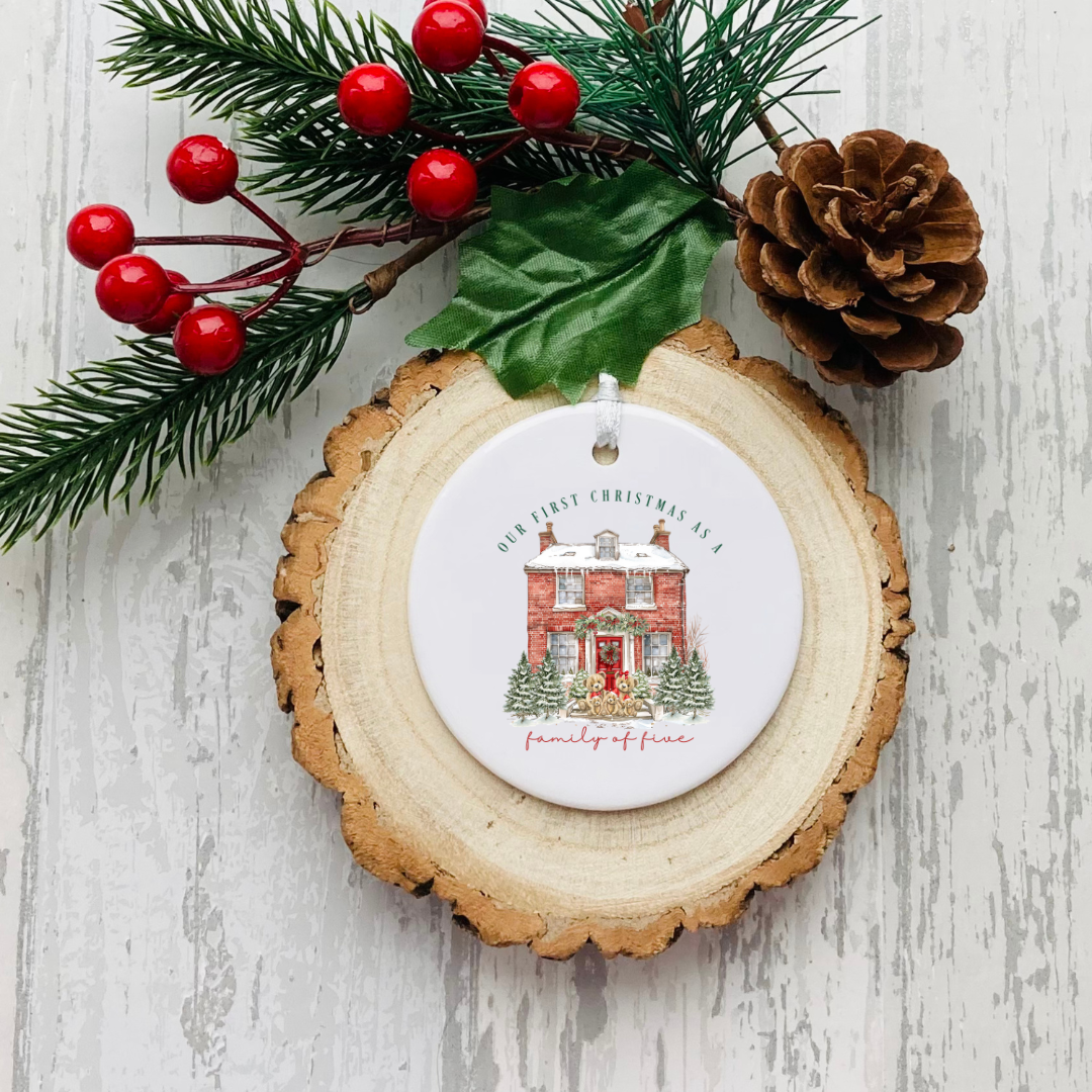 Personalised ceramic Christmas bauble with red house and personalised first Christmas wording