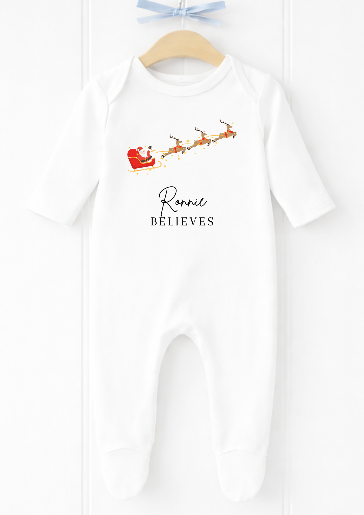 Personalised flying Santa sleigh Christmas sleepsuit and baby vest