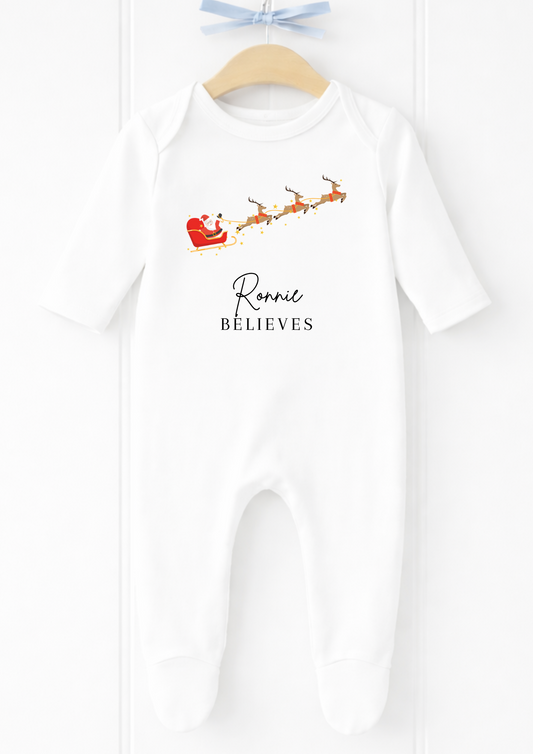 Personalised flying Santa sleigh Christmas sleepsuit and baby vest