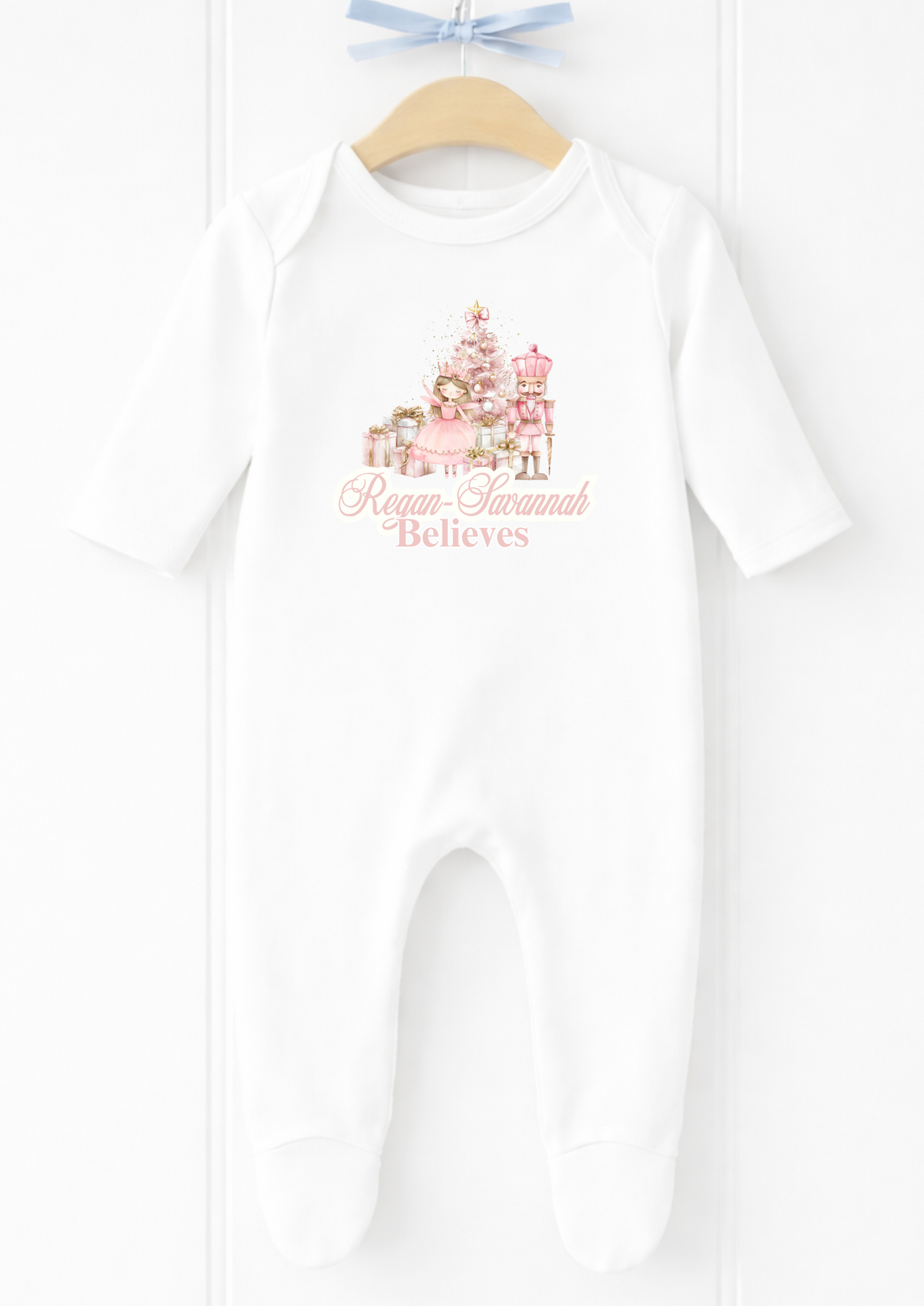 Personalised pink nutcracker believes sleepsuit and baby vest