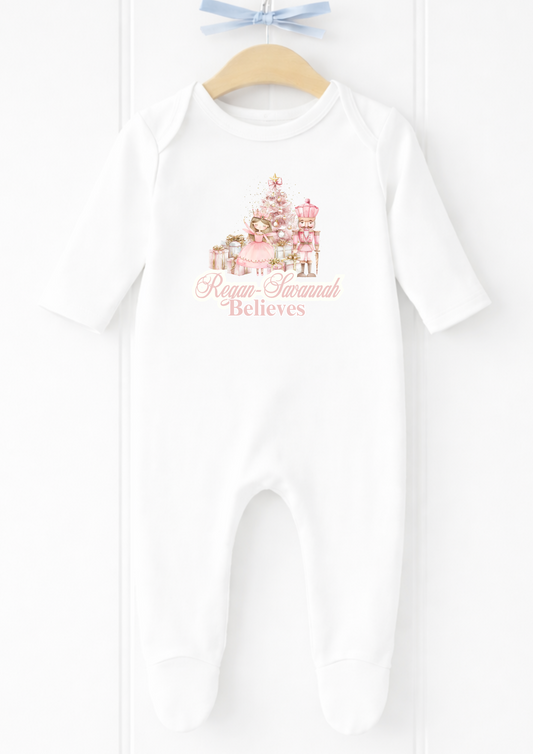 Personalised pink nutcracker believes sleepsuit and baby vest