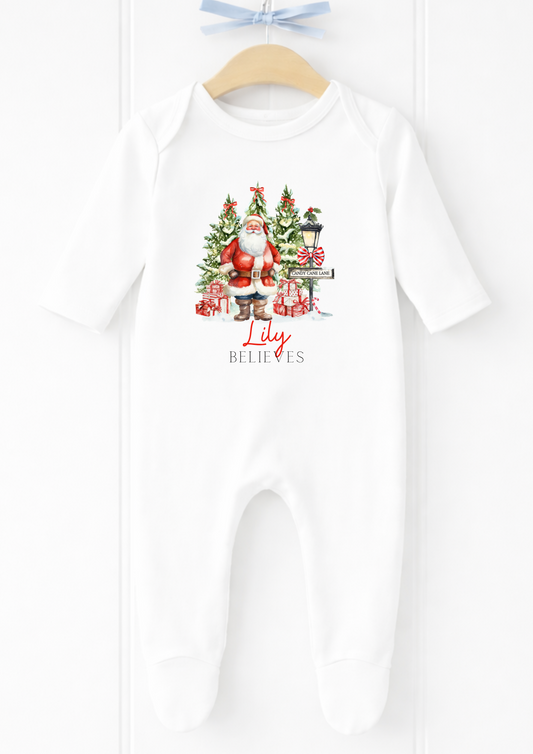 Personalised Santa village believes Christmas sleepsuit and vest