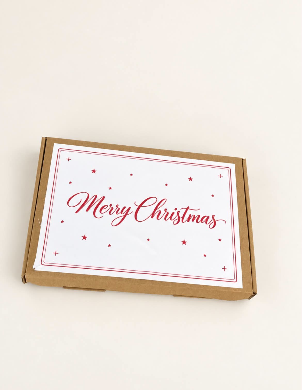 Kraft Christmas gift box with red Merry Christmas label