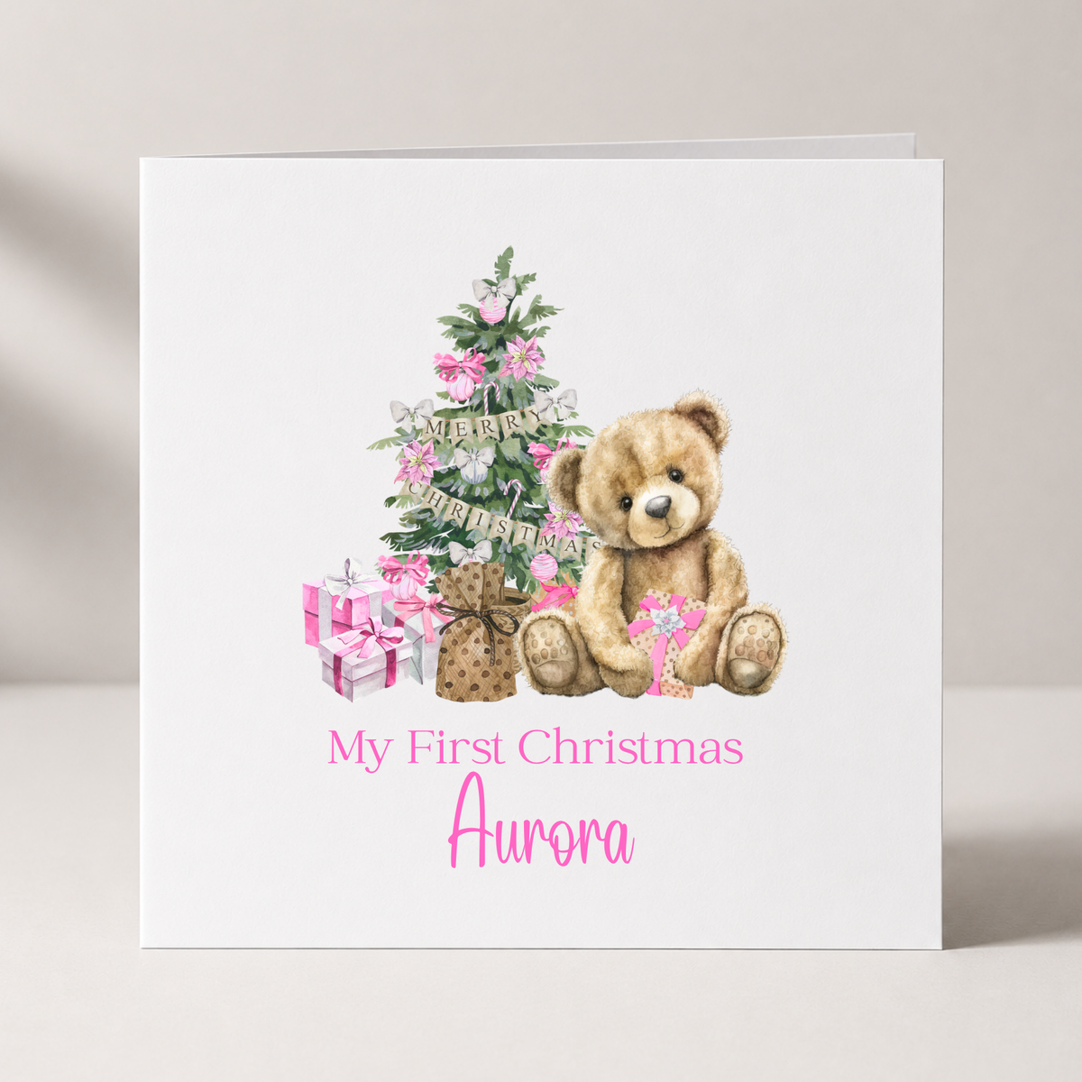Pink Teddy Bear Baby's First Christmas Card with custom names and wording